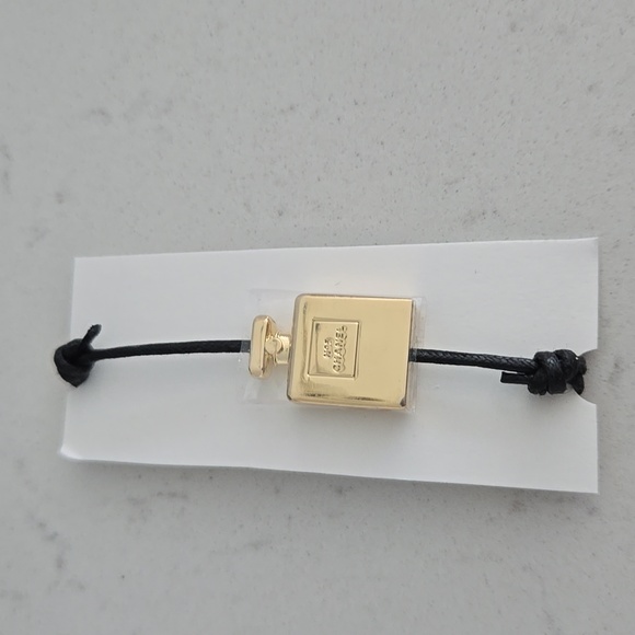 Brand new never used CHANEL bracelet gold bottle charm N°5 adjustable black cord - Picture 2 of 6